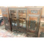 A Chinese carved hardwood breakfront display cabinet, glazed door, length 152cm, depth 33cm, height