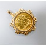 An 1894 gold sovereign in fancy yellow metal mount, overall 39mm, gross weight 12 grams.