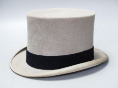 A Scott & Company brown leather case containing a grey top hat