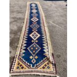 A long Eastern flatweave Kelim runner, 540 x 108cm