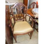 A set of six Hepplewhite style mahogany dining chairs, two with arms