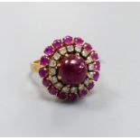 An Indian yellow metal, cabochon ruby and diamond cluster ring, size N, gross weight 8.3 grams, (