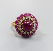 An Indian yellow metal, cabochon ruby and diamond cluster ring, size N, gross weight 8.3 grams, (