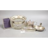 A small selection of decorative silver items to include a Georgian pierced strainer, a mustard pot,