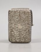 A Persian embossed white metal cigarette case (a.f.), 97mm, 117 grams.