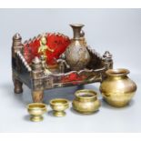 An Indian shrine stand, metalware figures and vessels (9), stand 29.5 cm wide