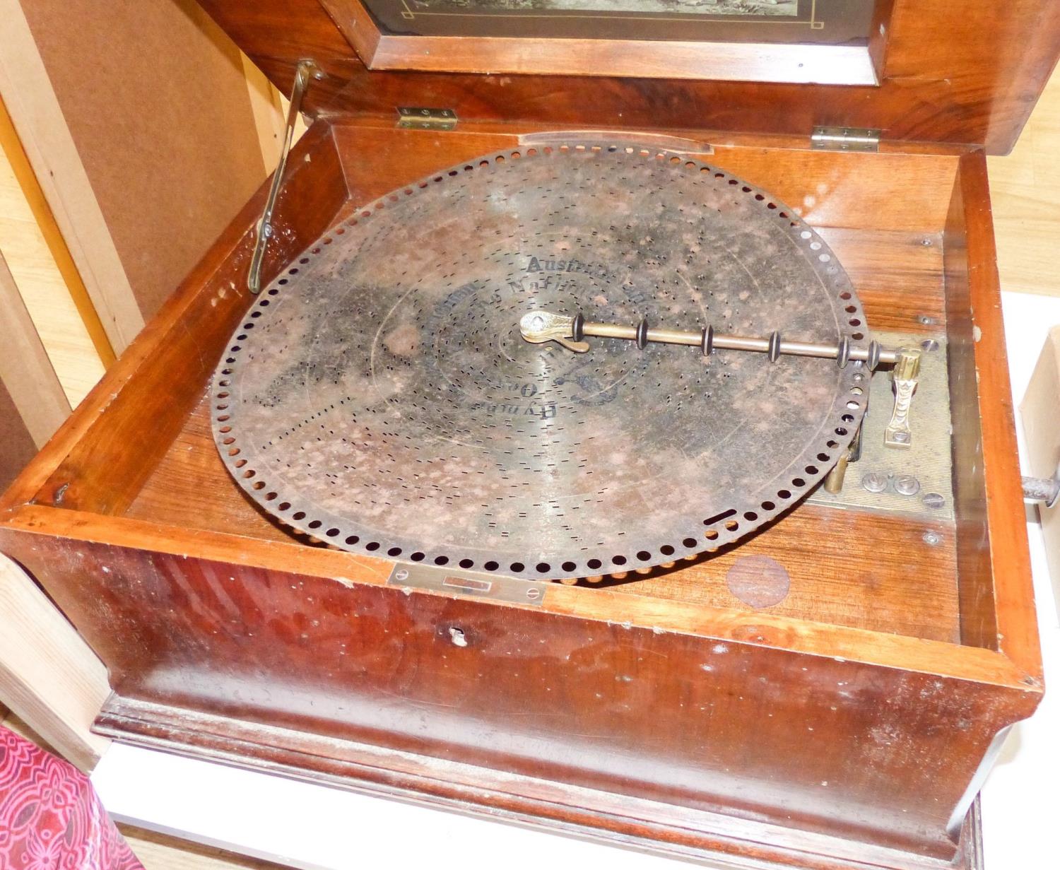 A Walnut and marquetry cased polyphon, 54cm and various 40cm discs