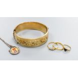 A filled 9ct gold bangle together with a three-stone 18ct yellow gold diamond ring (gross 2.6g) a