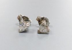 A pair of modern white metal and solitaire heart shaped diamond set ear studs, diameter approx.