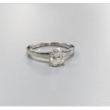 A modern 18ct white gold and solitaire oval cut diamond ring, size M, gross 3.1 grams, with GIA