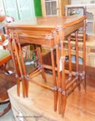 A nest of three Edwardian style inlaid mahogany serpentine tea tables, width 55cm, depth 35cm,