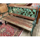 A cast iron and wood garden bench