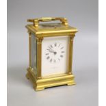 An early 20th century French brass Corinthian pattern repeating carriage clock, 19cm high handle up