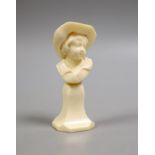 A carved ivory bust of a boy wearing a hat, early 20th century, 11.5 cm high