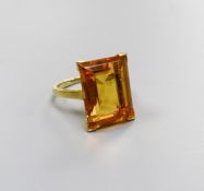 A modern yellow metal and emerald cut citrine set dress ring, size K, gross weight 6.6 grams.