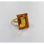 A modern yellow metal and emerald cut citrine set dress ring, size K, gross weight 6.6 grams.