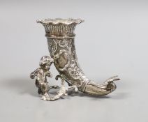 A late Victorian small silver cornucopia vase, with putto surmount, import marks for Thomas Glaser,
