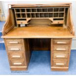 An early 20th century oak roll top desk with 'S' shaped tambour, width 120cm, depth 78cm, height of