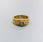 A modern 18ct gold, single stone sapphire and four stone diamond collet set dress ring, size M/N,