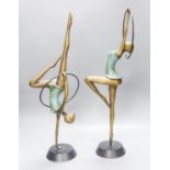 A pair of Hagenauer style bronze figures of hoop dancers, 51.5cm high