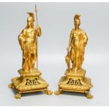 A pair of late 19th century ormolu figures of Roman soldiers, on openwork faces, tallest 32.5 cm