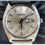 A gentleman's 1980's stainless steel Seiko Lord Matic day date wrist watch, on associated strap,