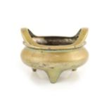 A large Chinese bronze tripod censer, ding, Xuande mark, Qing dynasty,the rim with a pair of high