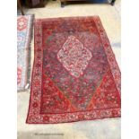 A North West Persain red ground rug, 200 x 132cm