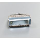 A modern 18k white metal, fancy cut blue topaz and diamond chip set dress ring, size L, gross