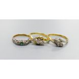 Two 18ct and three stone diamond set crossover rings, sizes K and N and an 18ct & plat, emerald and