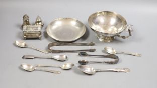 A Persian white metal tea cup and saucer and small sile items including two pepperettes, a trinket