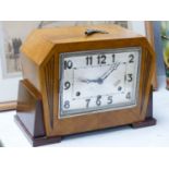 An Art Deco walnut cased eight day mantel clock, 32.5 cm wide