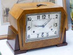 An Art Deco walnut cased eight day mantel clock, 32.5 cm wide