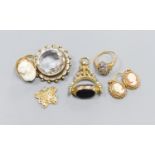 A 9ct gold cameo ring, a pair of similar earrings, yellow metal settings, a 9ct gold gem-set ring,