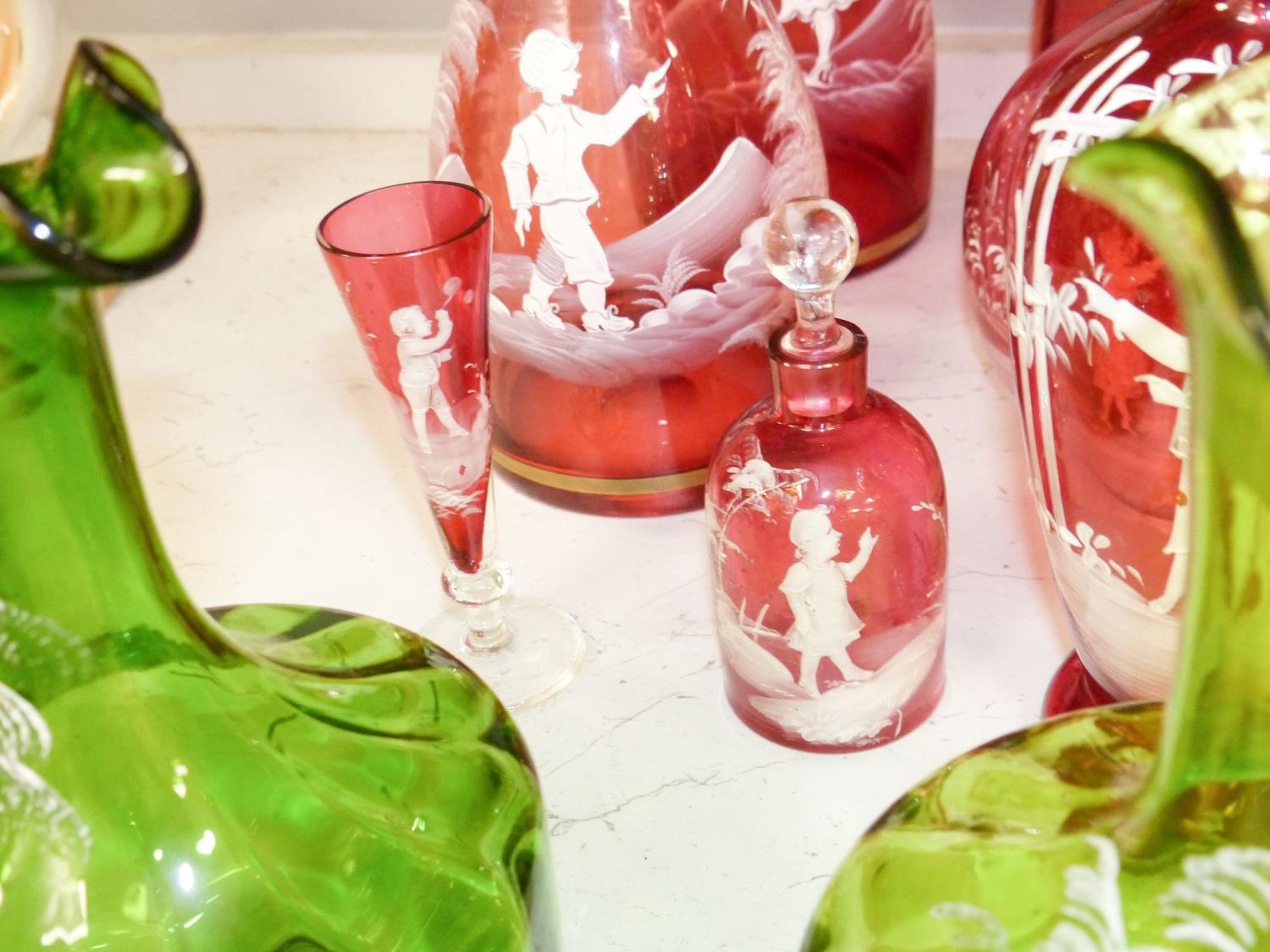 A collection of Mary Gregory cranberry and green glass decanters, jug etc (9), tallest 28.5 cm - Image 3 of 6