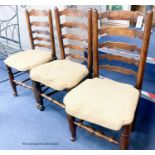 A harlequin set of eight ash rush seat ladder back dining chairs with squab seats