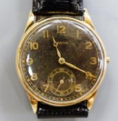 A gentleman's 14k yellow metal Zenith manual wind wrist watch, with subsidiary seconds, on later