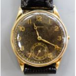 A gentleman's 14k yellow metal Zenith manual wind wrist watch, with subsidiary seconds, on later