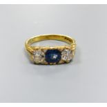 A 1970's Victorian style 18ct gold, single stone synthetic? sapphire and two stone diamond set