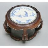 A 19th century Chinese blue and white circular tile inset hongmu stand, 22cm