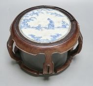 A 19th century Chinese blue and white circular tile inset hongmu stand, 22cm