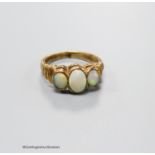 A 9ct gold and three stone white opal set half hoop ring, with ribbed shoulders, size K, gross 3.5