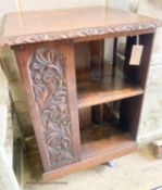 An early 20th century carved oak revolving bookcase, length 52cm, height 79cm