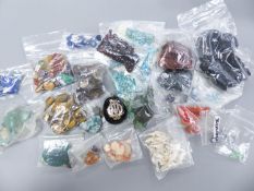 A quantity of assorted unmounted gemstones including, opal, opal doublet, malachite, chalcedony,