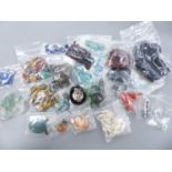 A quantity of assorted unmounted gemstones including, opal, opal doublet, malachite, chalcedony,