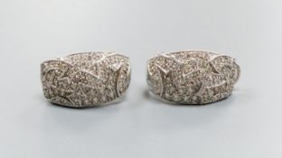 A modern pair of 18k white metal and pave set diamond demi-lune earrings, 21mm, gross 9.7 grams.