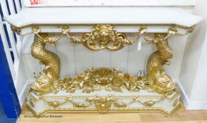 A Louis XVI style painted composition and giltwood console table on dolphin supports, width 146cm,