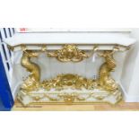 A Louis XVI style painted composition and giltwood console table on dolphin supports, width 146cm,