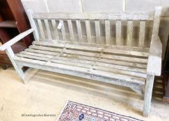 A weathered teak garden bench, length 159cm, depth 56cm, height 81cm
