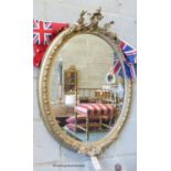 A Victorian oval giltwood and gesso wall mirror, width 61cm, height 86cm